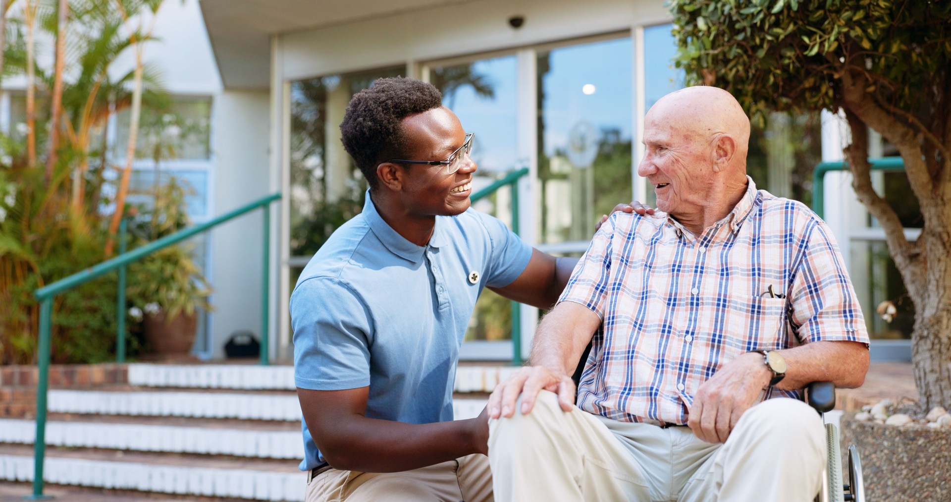 Nurse, smile and healthcare with old man in wheelchair for rehabilitation, osteoarthritis and physiotherapy. Medical, retirement and caregiver with person with a disability for trust and elderly care